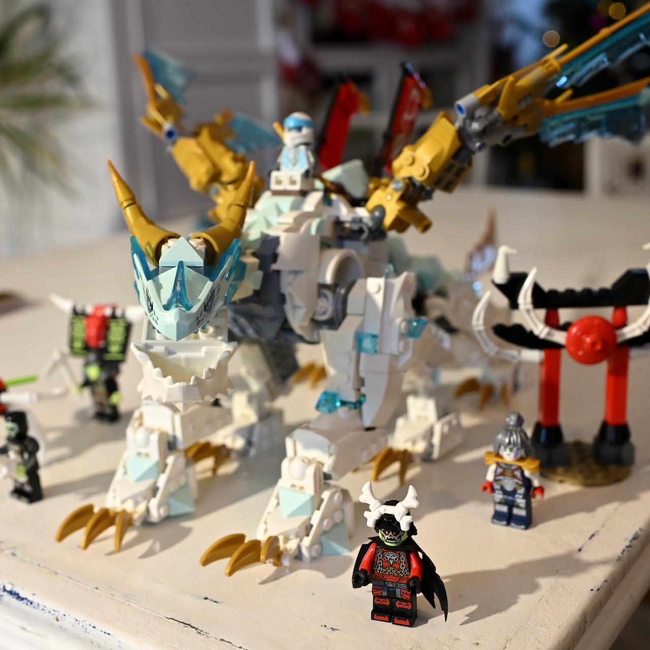 Just a lego dragon on a table.